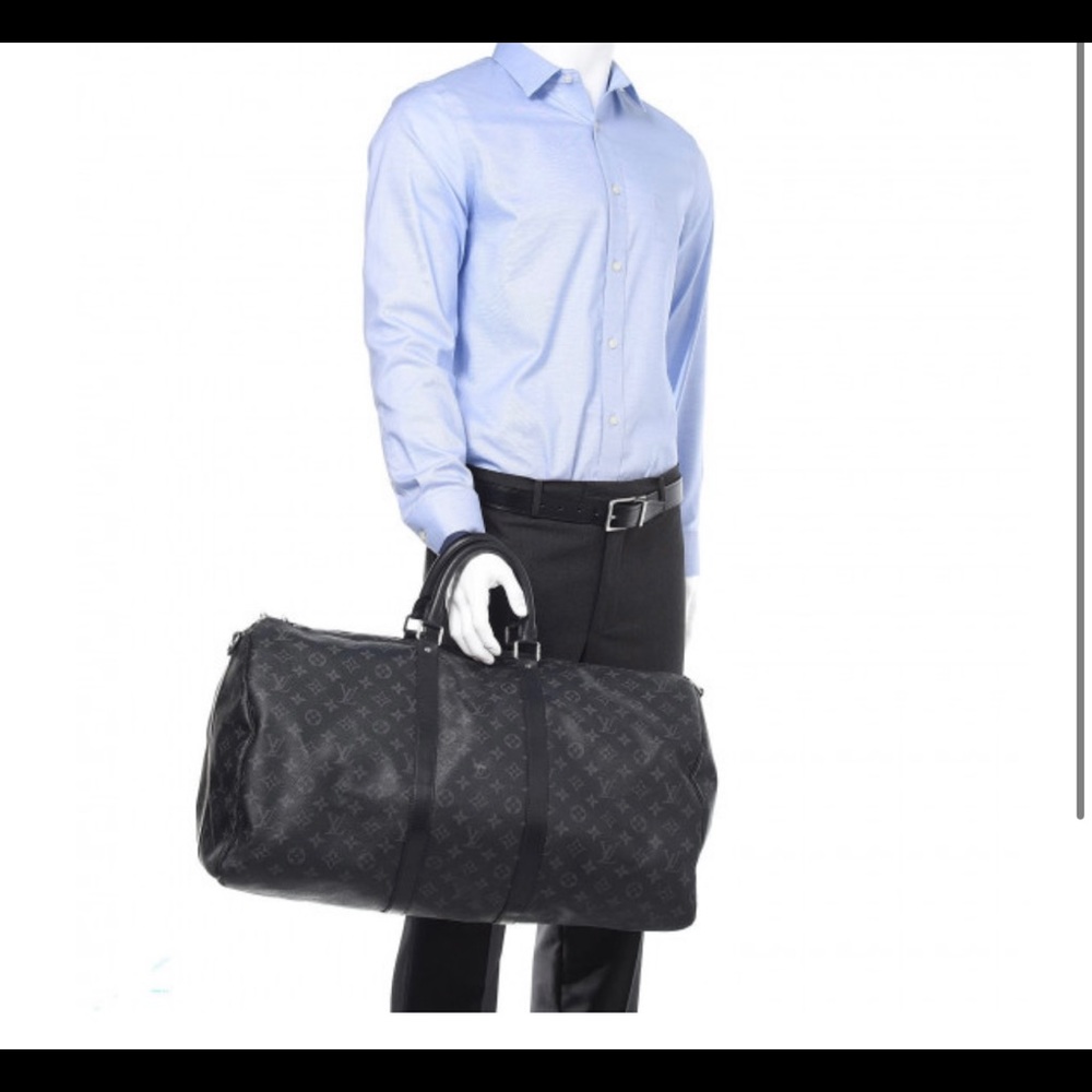 This is an authentic LOUIS VUITTON Monogram Eclipse Keepall Bandouliere 55.